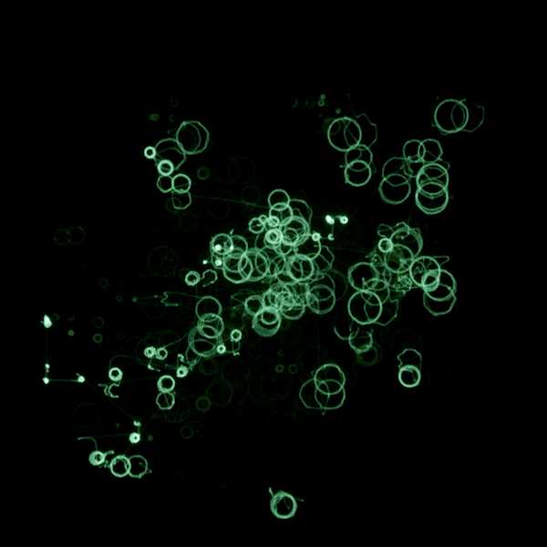 still from the oscilloscope composition 10 Million Hertz. A smattering of green circles covers a black background
