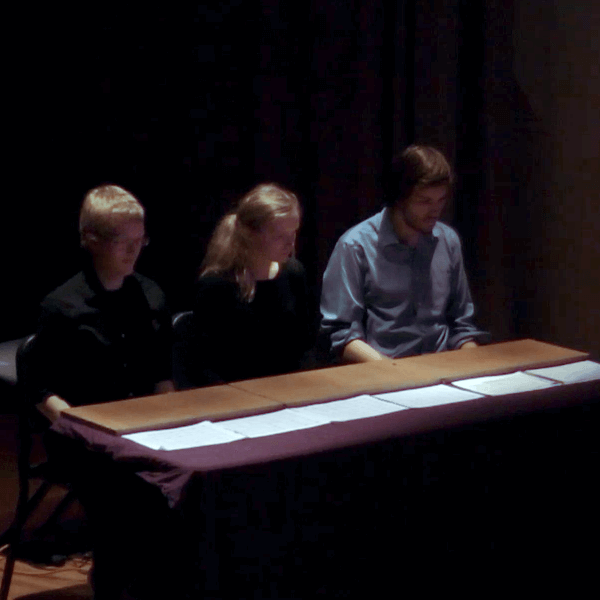 From left to right: Eric Lennartson, Krystina Shivalkova, and Henry Delargy sitting at a table.